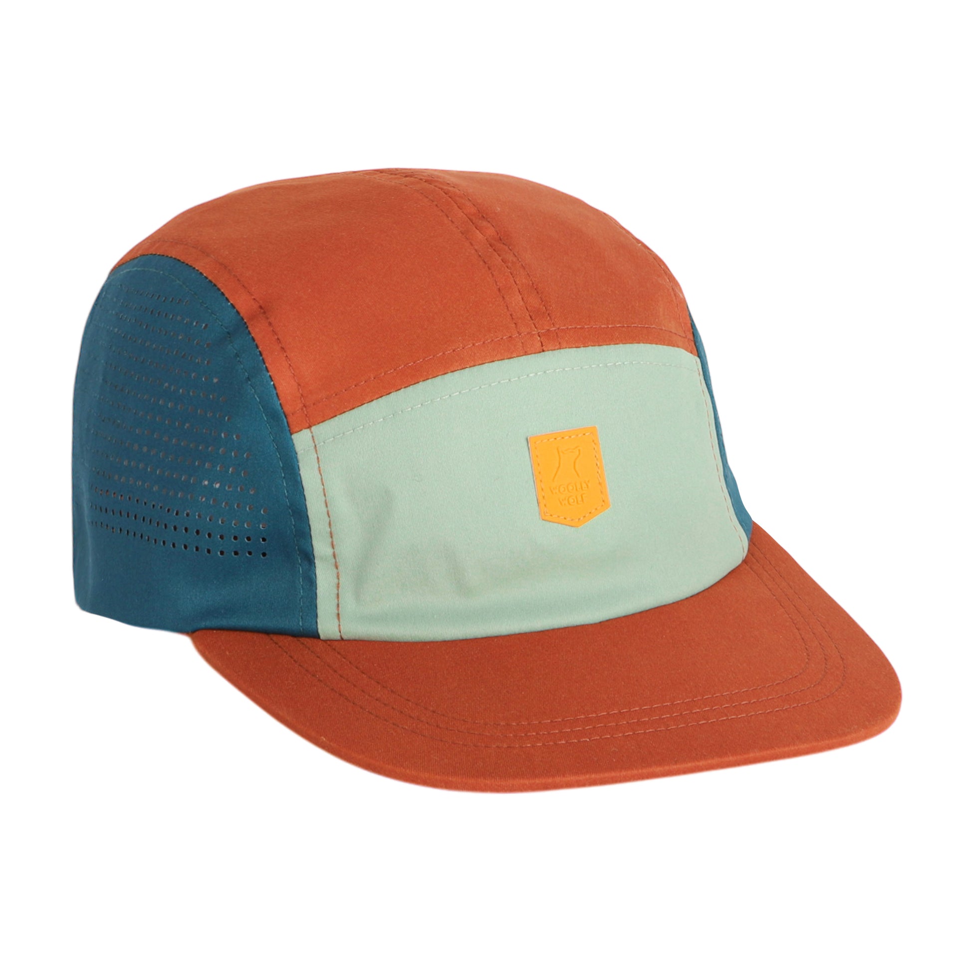 The Alpha 360 Tech Cap Terracotta features rust orange, teal, and light green panels, a yellow rectangular front patch, and perforated holes on the teal side panel.