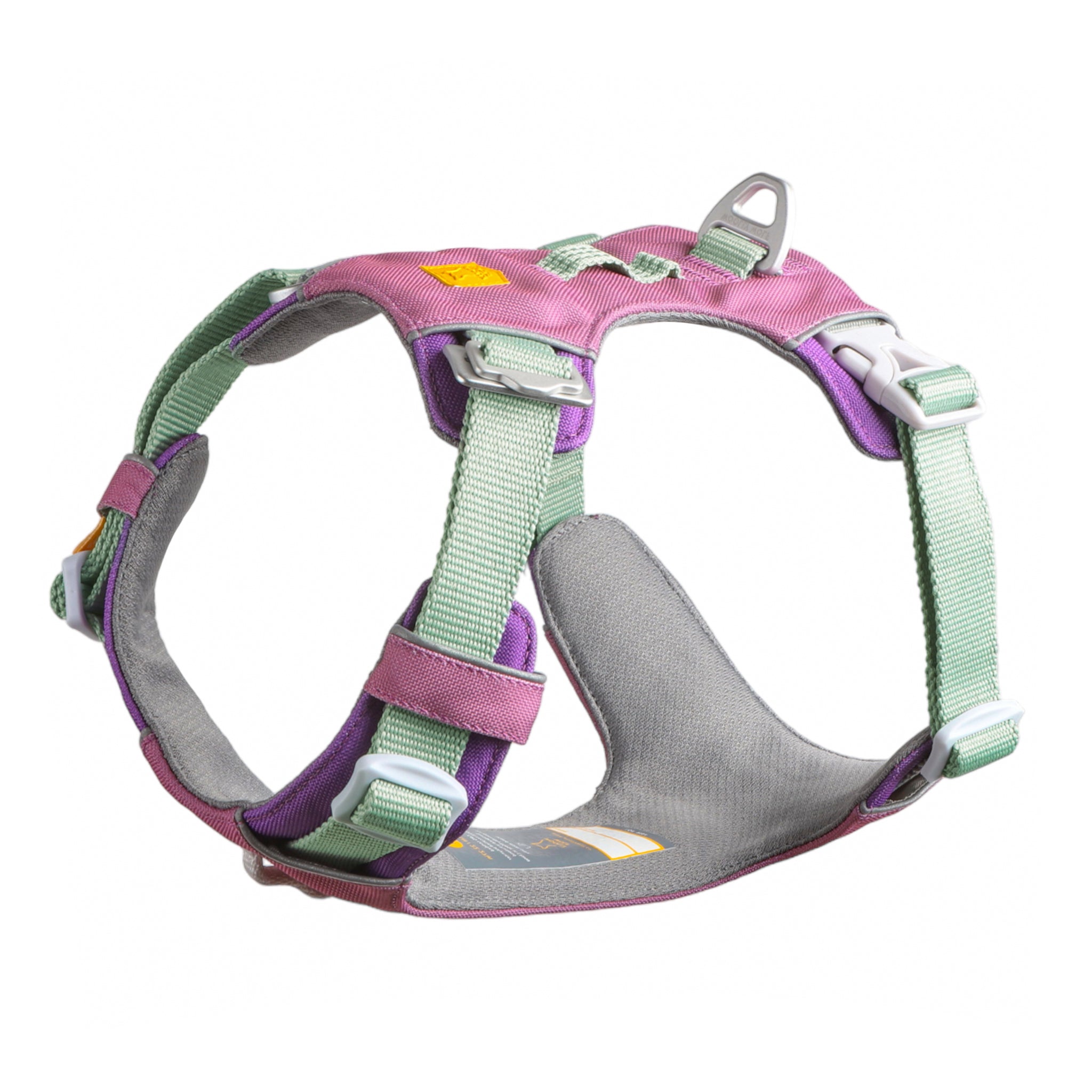 The Alpha 360 Dog Harness Mauve Mix, featuring pink, green, and purple padded material, adjustable straps, a metal leash attachment, and plastic buckles, is shown on a white background.