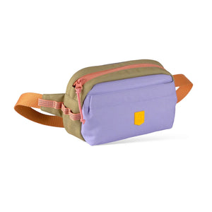 A small bag with a purple front, tan top, orange zippers, and an orange adjustable strap.