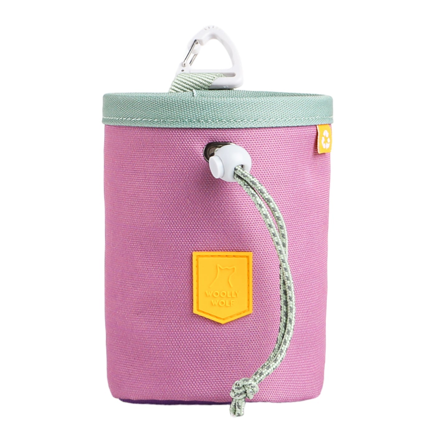 The Alpha 360 Dog Snack Bag Mauve Mix is a cylindrical, lavender pouch with a green drawstring closure, a lid, yellow dog logo patch, and a white carabiner on top.