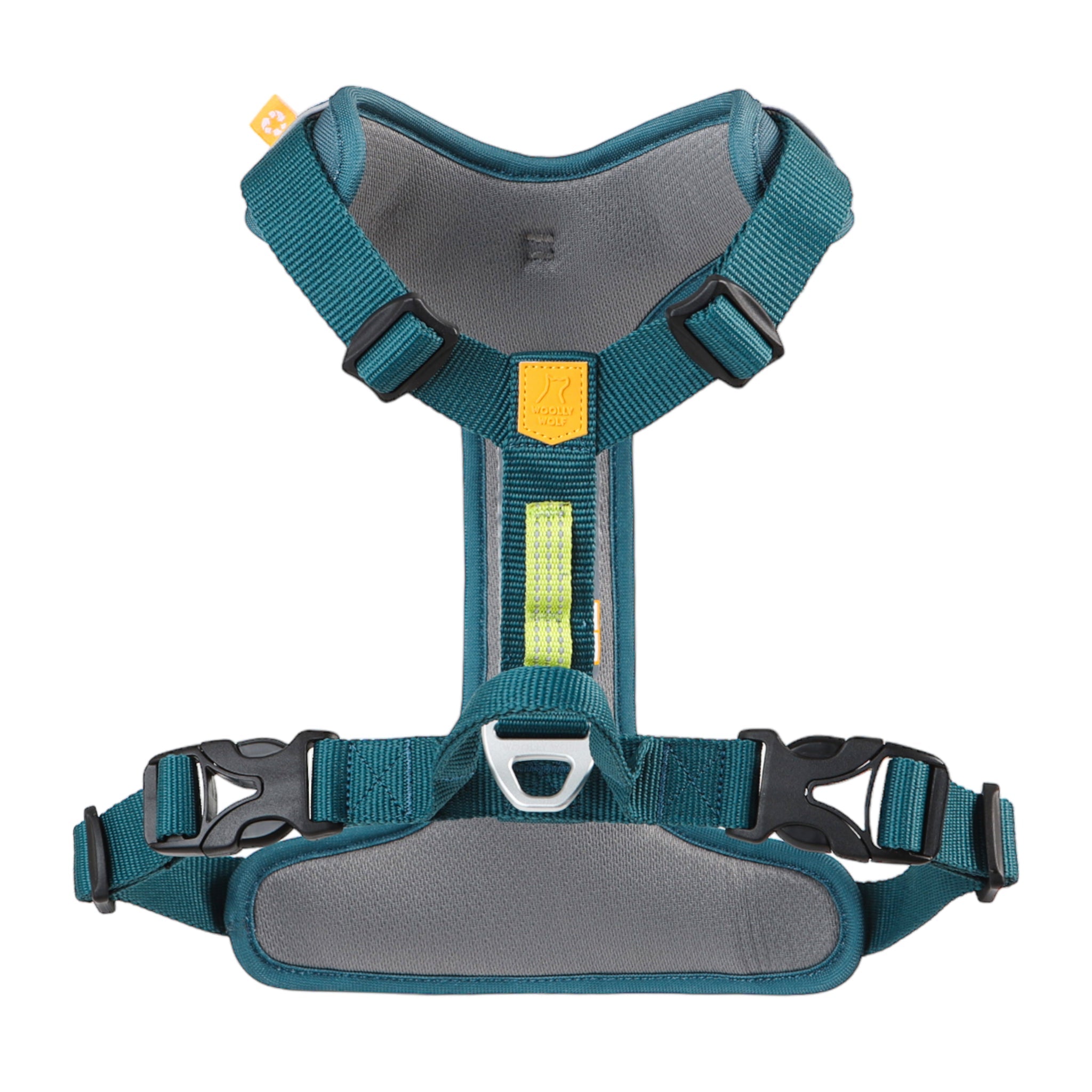 The Roam Dog Harness Deep Teal features adjustable teal and gray straps, black plastic buckles, a metal leash ring, padded chest and back panels, and a small yellow tag near the top.