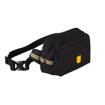 Black fanny pack with a yellow logo tag and an adjustable buckled strap.