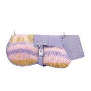 Lavender and pastel sherpa horse blanket with buckle strap and WOOLF WEAR logo embroidered on the side.