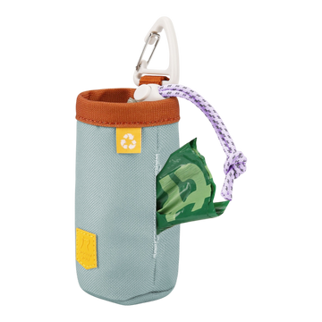Light blue fabric dog waste bag holder with a carabiner and a green bag visible through a side opening.