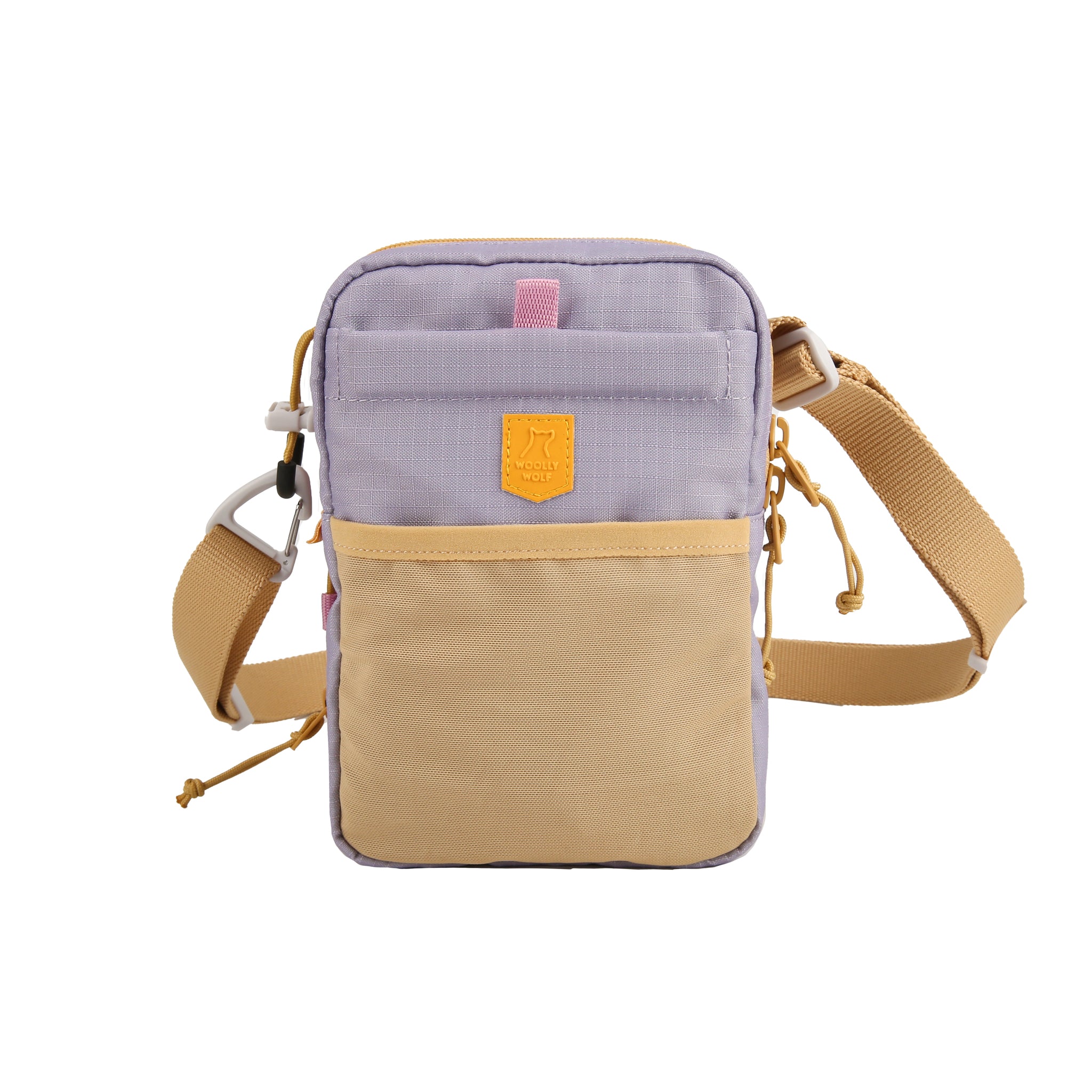 Small crossbody bag with tan strap, tan front pocket, and lavender body, featuring a yellow patch logo.