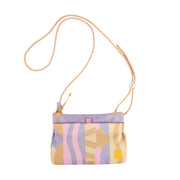 Small crossbody bag with pastel abstract patterns in beige, pink, and purple, and a thin tan strap.