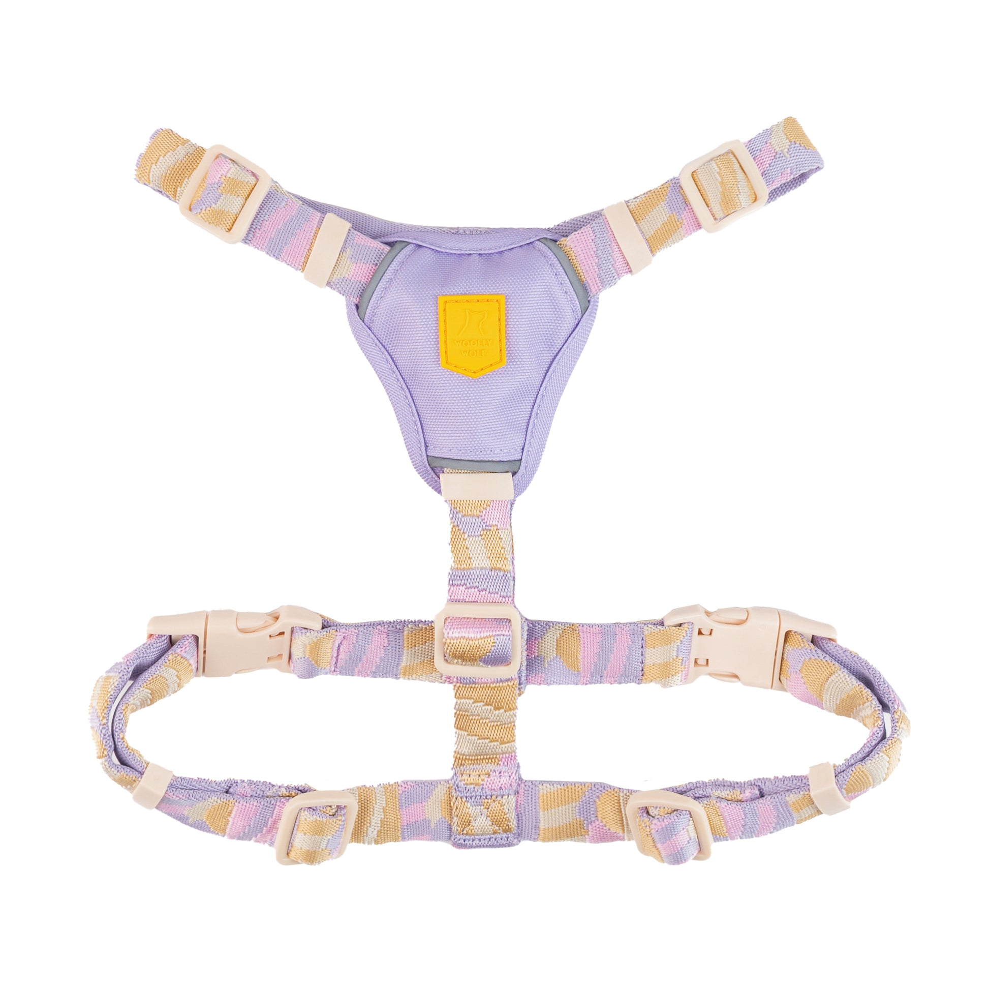 Pastel-colored adjustable pet harness with beige, purple, and pink straps and plastic buckles, laid flat on white.