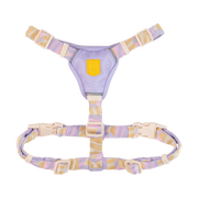Lavender and beige adjustable pet harness with a yellow patch and plastic buckles, shown on a white background.