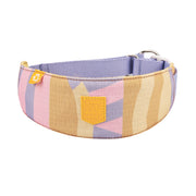 Wide, pastel-colored dog collar with geometric patterns, a yellow label, and a metal buckle.