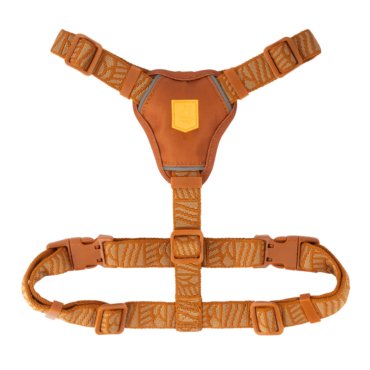 Orange patterned dog harness with a central chest pad and adjustable straps.
